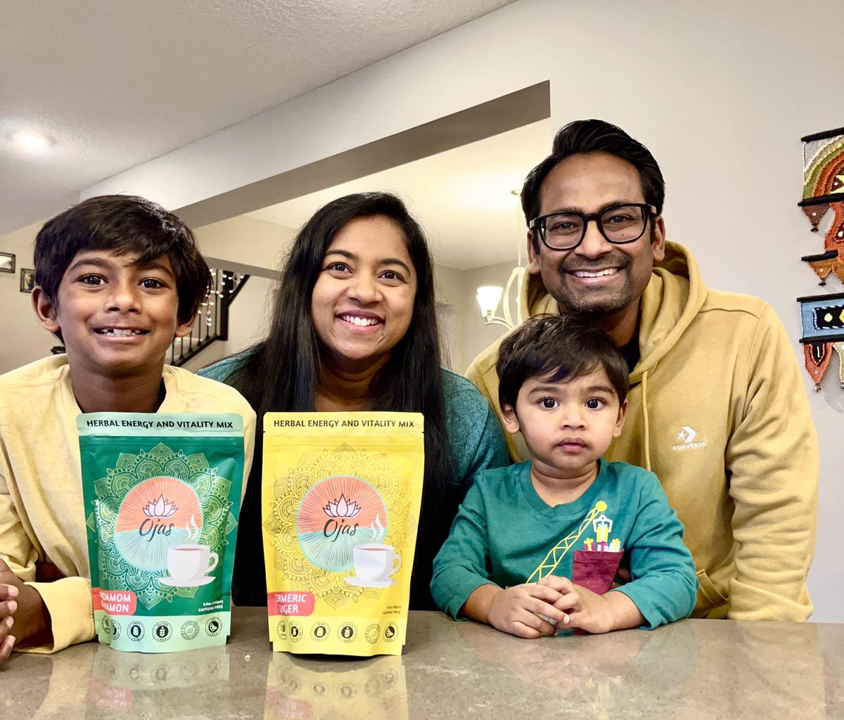 Vanashree and Bhushan with their children and the four Ojas blends in their kitchen